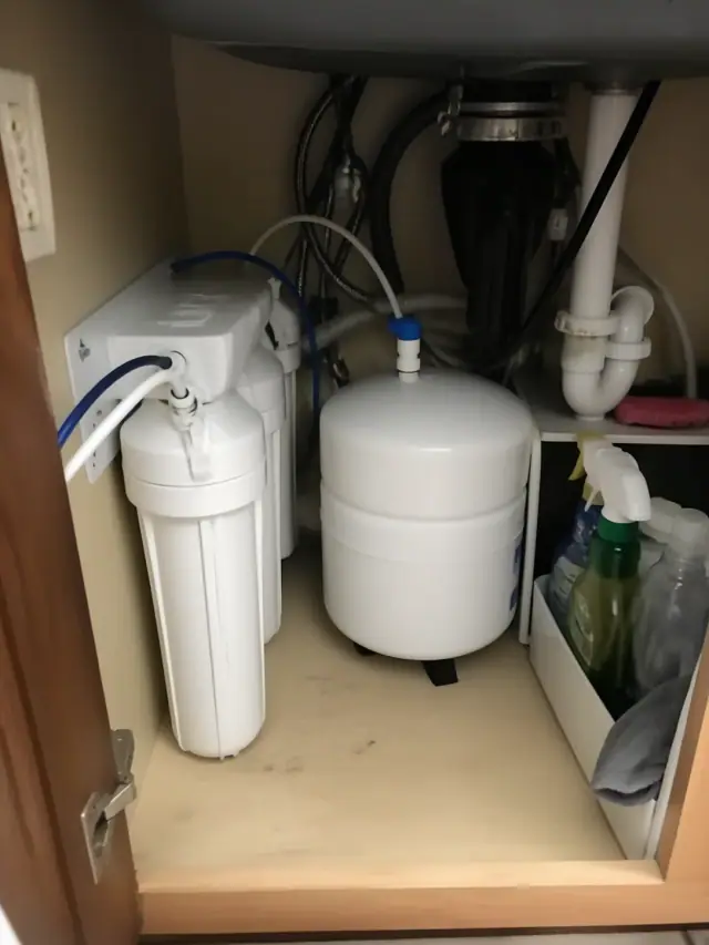 Reverse osmosis water filtration system installed under a kitchen sink in a Mesa, AZ home.