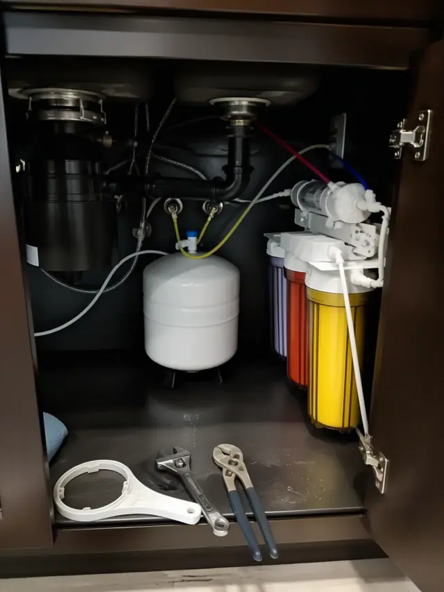 Reverse osmosis water filtration system installed under a kitchen cabinet in Mesa, AZ.