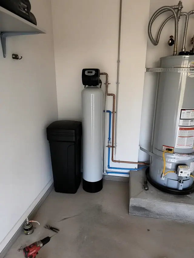 Water softener and filtration system installed in a residential garage in Queen Creek, AZ.
