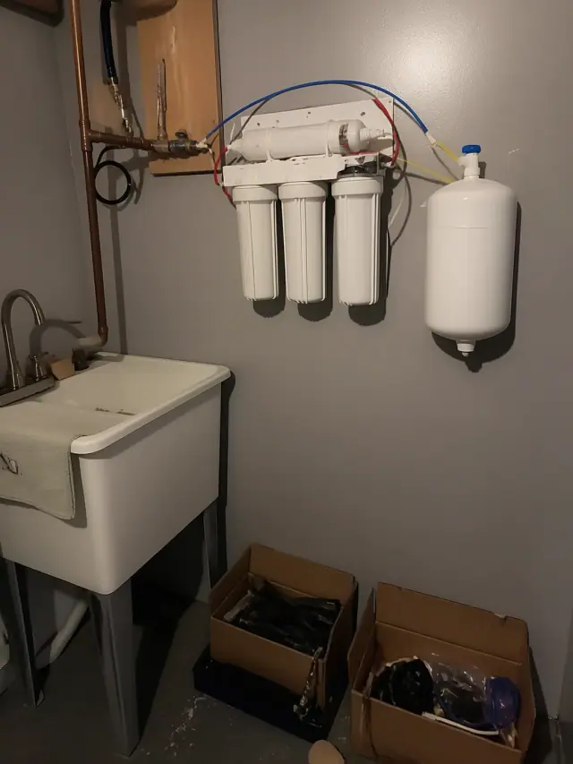 Reverse osmosis water filtration system installed on a utility room wall in a home in Mesa, AZ.