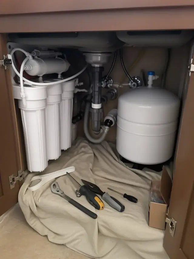Reverse osmosis water filtration system installed under a kitchen sink in Ahwatukee, AZ.
