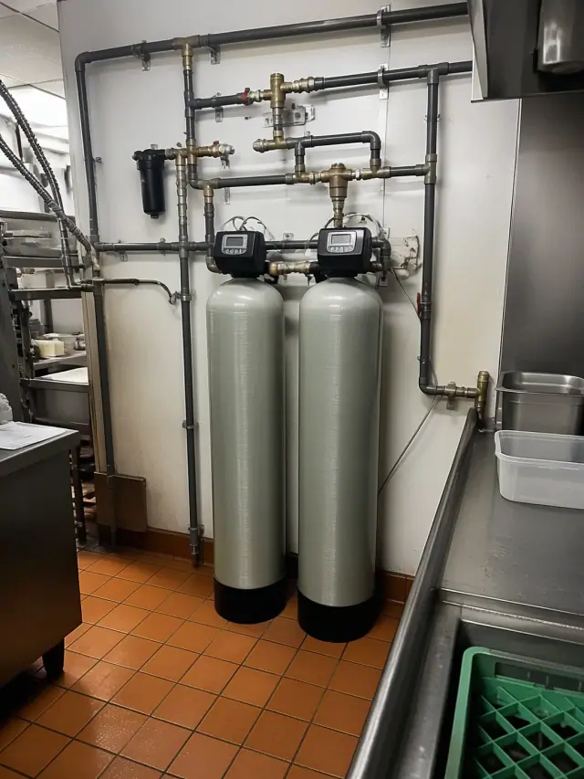 Two industrial water filtration tanks installed in a restaurant kitchen in Mesa, AZ.