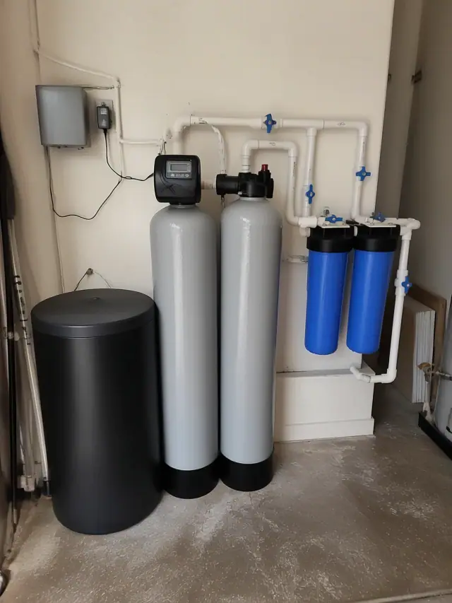 Newly installed water softener and filtration system in an Ahwatukee, AZ residential garage.