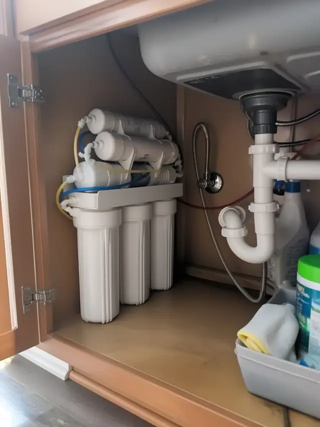 Reverse osmosis water filtration system installed under a kitchen sink in Mesa, AZ.