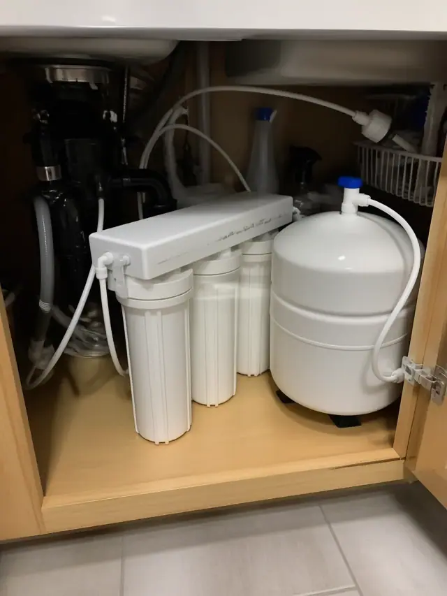Reverse osmosis water filtration system installed under a kitchen sink in a Peoria, AZ home.