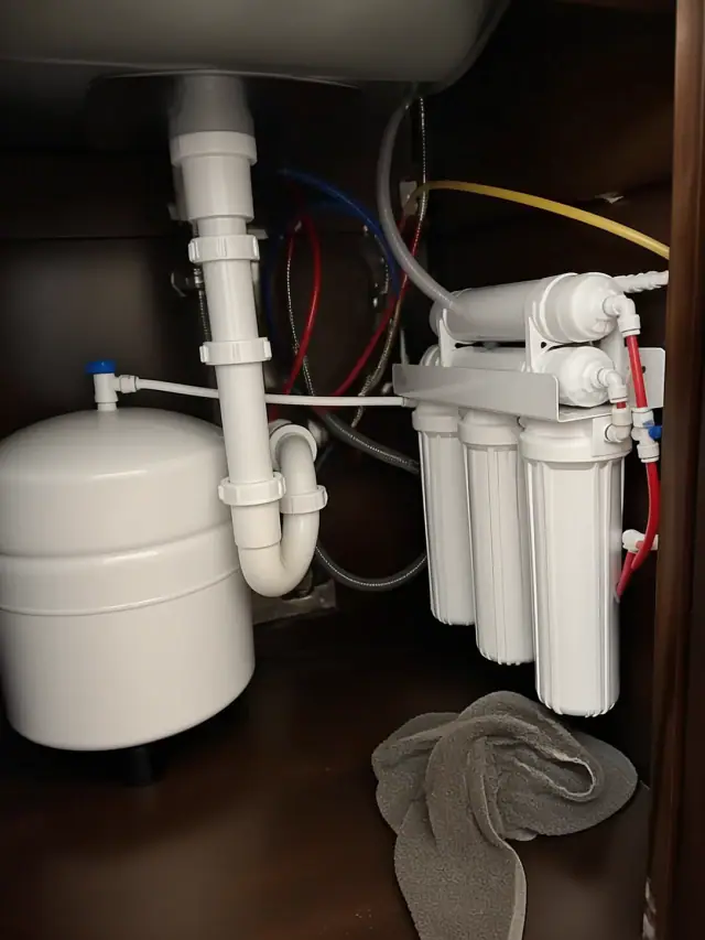 Reverse osmosis water filtration system installed under a kitchen sink in Mesa, AZ.