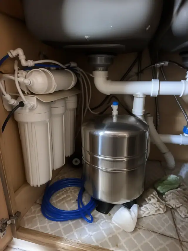 Newly installed reverse osmosis water filtration system under a kitchen sink in a Tempe, AZ home.