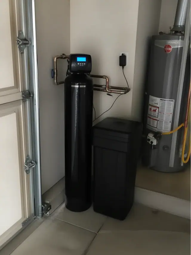 Water softener and filtration system installed in a garage in Gilbert, AZ.
