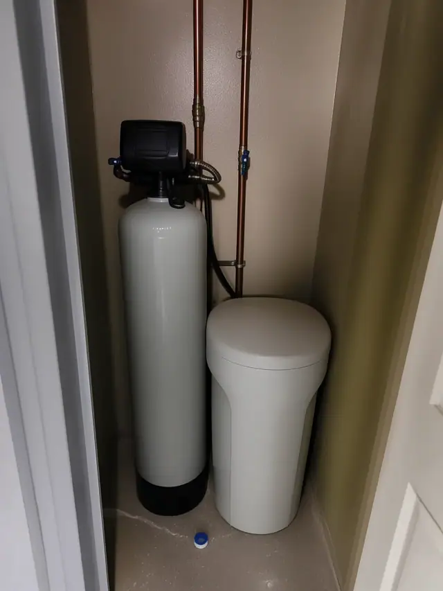 New water softener installation with copper piping in a utility closet in Apache Junction, AZ.