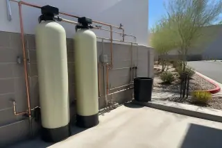 Commercial water softener pipes and industrial valves installed at a warehouse in Mesa, AZ.