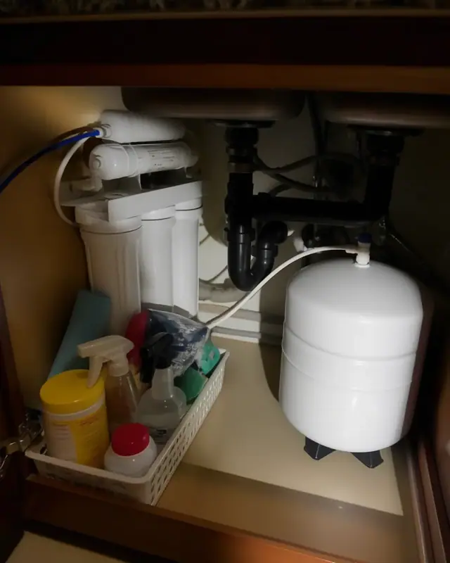 New reverse osmosis water filtration system installed under a kitchen sink in Mesa, AZ.