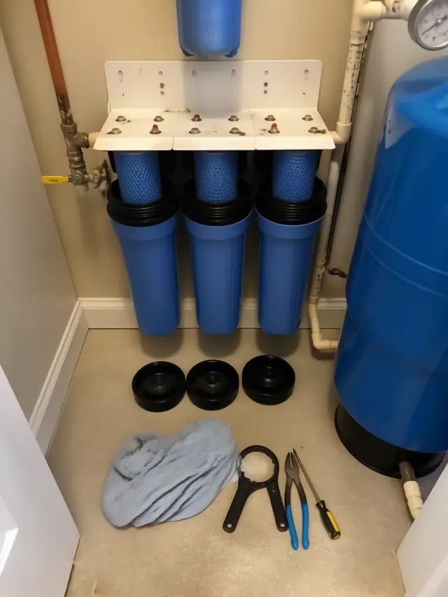Completed annual maintenance on a residential water filtration system in a Mesa, AZ utility closet.