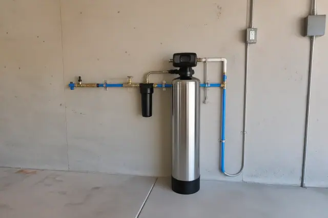 Salt-free water conditioner system installed on a garage wall in Mesa, AZ.