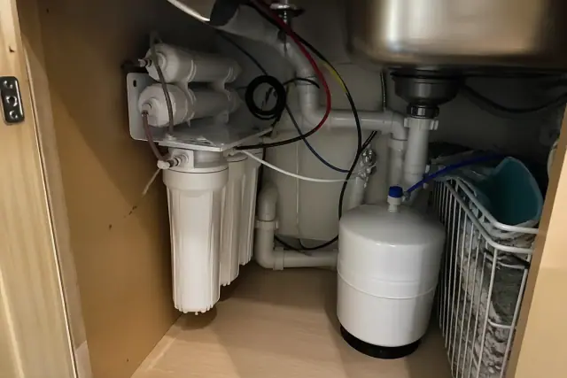 Reverse osmosis water filtration system installed under a kitchen sink in a home in Mesa, AZ.