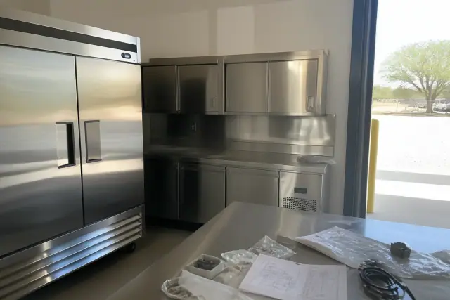 Stainless steel commercial refrigeration equipment installed in a kitchen workspace in Phoenix, AZ.