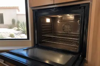 Polished interior of a wall oven cavity during a final inspection in a Phoenix, AZ home.