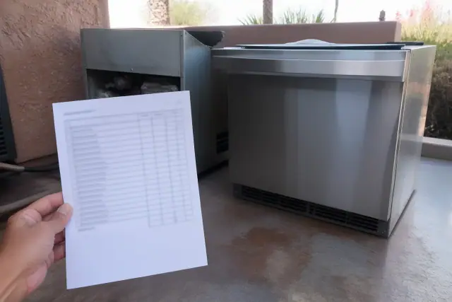 A repair quote next to a new appliance on a floor in Phoenix, AZ.