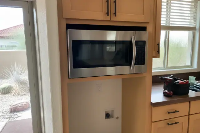 Residential microwave installed in a kitchen cabinet in Phoenix, AZ.