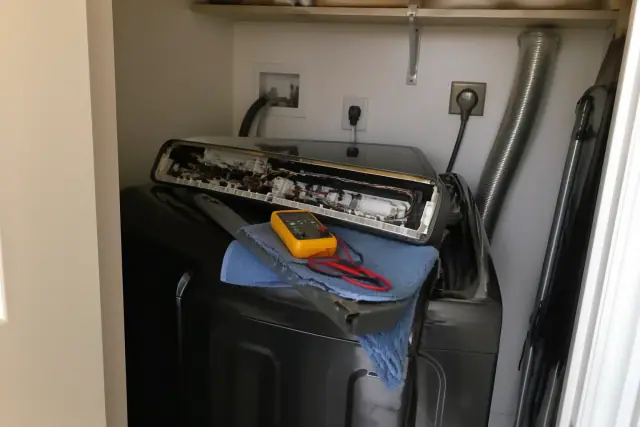 Samsung washer undergoing repair in a laundry closet in Phoenix, AZ.
