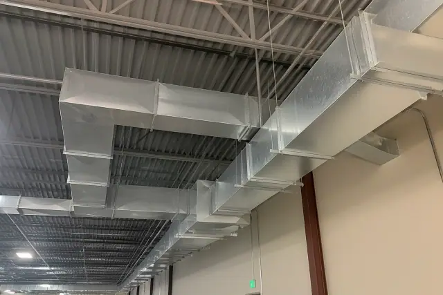 Galvanized steel rectangular HVAC ductwork installed on a ceiling in Phoenix, AZ.
