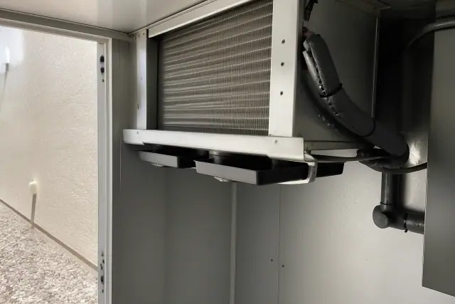 Commercial refrigeration unit with copper lines inside a walk-in cooler at a job site in Tempe, AZ.