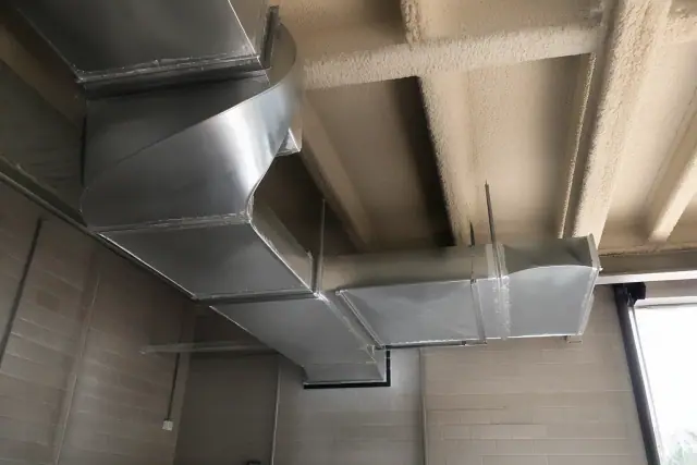 Custom galvanized steel ductwork installation in a Phoenix, AZ warehouse.