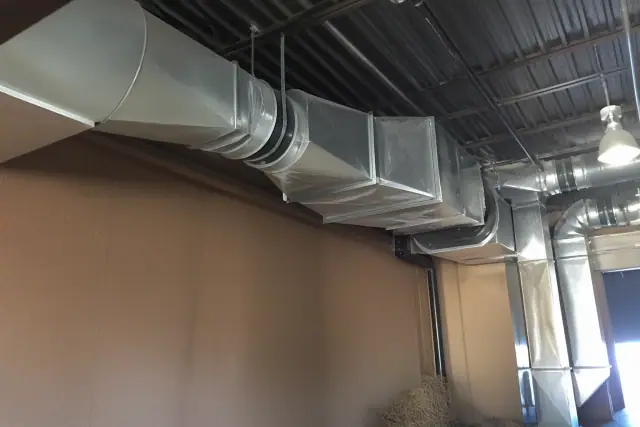 Galvanized steel ductwork installation on an industrial ceiling in Phoenix, AZ.