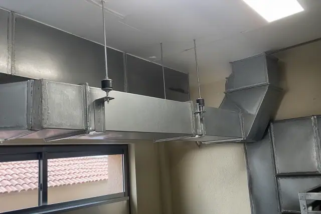 Galvanized steel ductwork installation in a commercial kitchen in Phoenix, AZ.