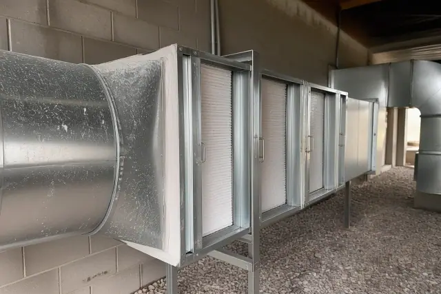 HVAC filtration housing with HEPA filters and ductwork in a commercial building in Phoenix, AZ.
