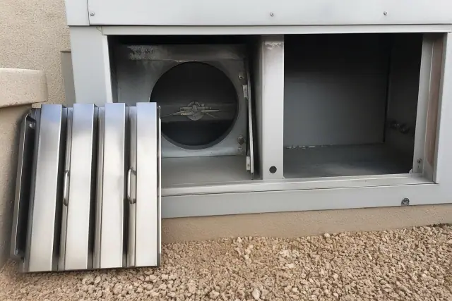 Stainless steel grease baffle and intake dampener blade of a kitchen exhaust system at a job site in Phoenix, AZ.