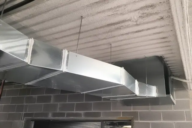 Rectangular galvanized sheet metal for commercial ductwork installed at an industrial job site in Phoenix, AZ.