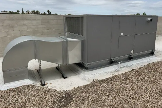 HVAC unit with ducting and vibration mounts on a restaurant rooftop in Phoenix, AZ.