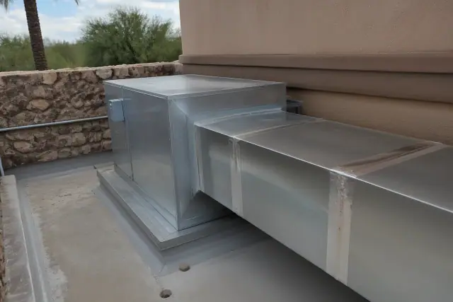 Tempered make-up air unit with metal ducting at a commercial kitchen site in Phoenix, AZ.