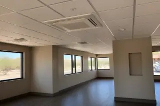 Ceiling-cassette VRF indoor unit flush-mounted in a drop ceiling grid with desert views in Phoenix, AZ.