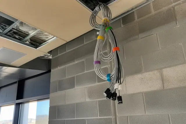 Bundled sensor cables with color-coded ties at a commercial indoor air quality jobsite in Phoenix, AZ.