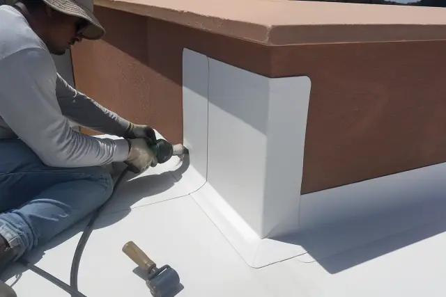 60-mil TPO membrane installed on a parapet wall corner with heat-welded seams in Phoenix, AZ.