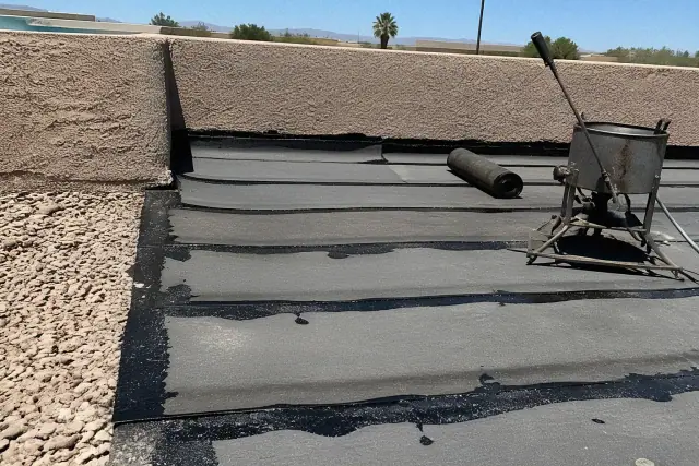 Built-up roofing installation with bitumen layers on a flat roof deck in Tempe, AZ.