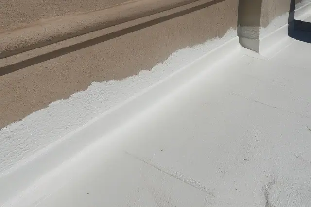 Spray foam roof coating applied to a parapet wall on a flat roof in Phoenix, AZ.