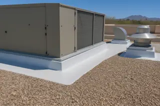 Membrane detailing around a rooftop ventilation unit near a tan gravel roof and stucco parapet in Phoenix, AZ.