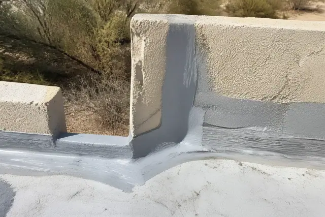 Close-up of membrane sealant applied to a corner flashing joint on a commercial building parapet in Surprise, AZ.
