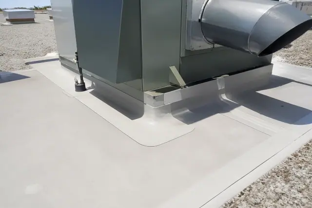 Heat-welded TPO membrane seams around an HVAC unit on a gravel rooftop in Peoria, AZ.