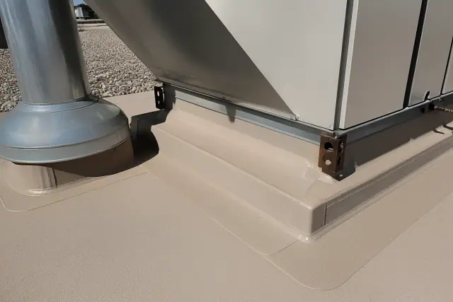 Commercial roof membrane detailing around an HVAC unit on a gravel rooftop in Gilbert, AZ.