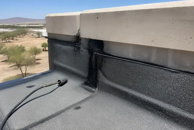 Modified bitumen roofing repairs on a parapet wall at a commercial job site in Phoenix, AZ.