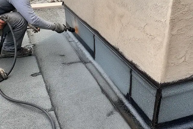 Modified bitumen roofing with torch-applied seams and parapet wall flashing on a commercial building in Buckeye, AZ.
