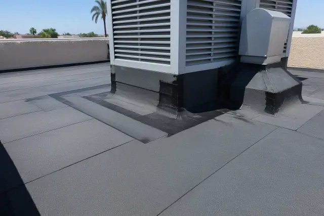 Modified bitumen roofing membrane installation around a rooftop ventilation unit in Tempe, AZ.