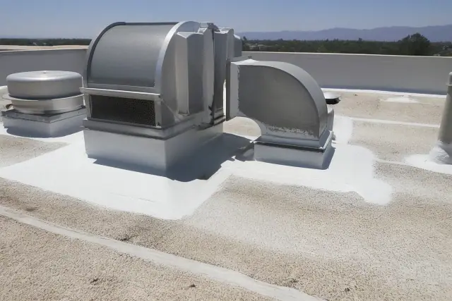 Fresh white reflective roof coating around an HVAC unit on a Phoenix, AZ rooftop.