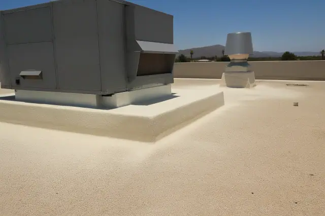 Spray foam roofing applied around a rooftop ventilation unit on a commercial building in Peoria, AZ.