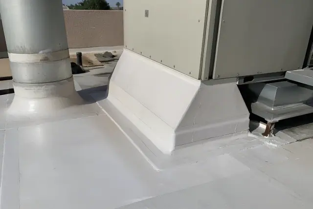 Technicians performing TPO membrane detailing around a rooftop HVAC unit in Phoenix, AZ.