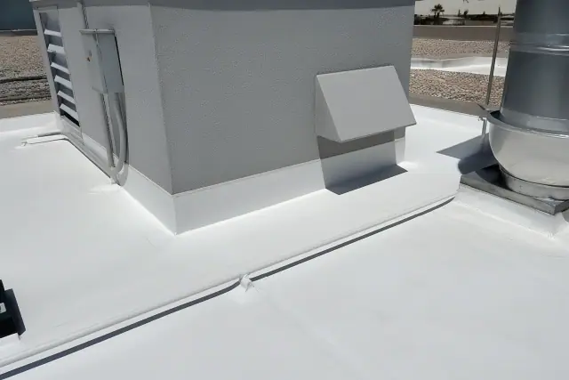 Heat-welded TPO membrane detailing around an HVAC unit on a roof in Phoenix, AZ.
