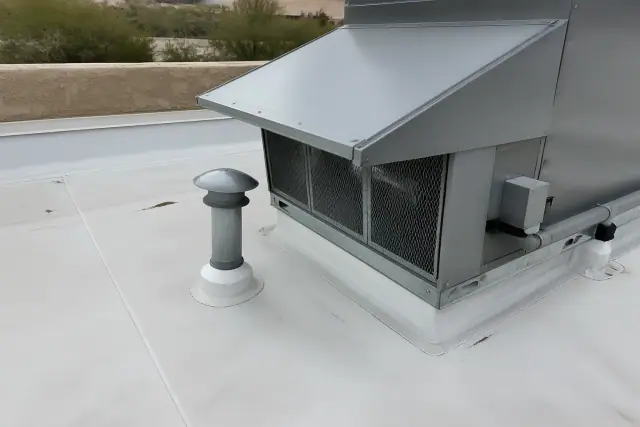 TPO membrane roofing with heat-welded seams around a commercial HVAC unit on a rooftop in Peoria, AZ.
